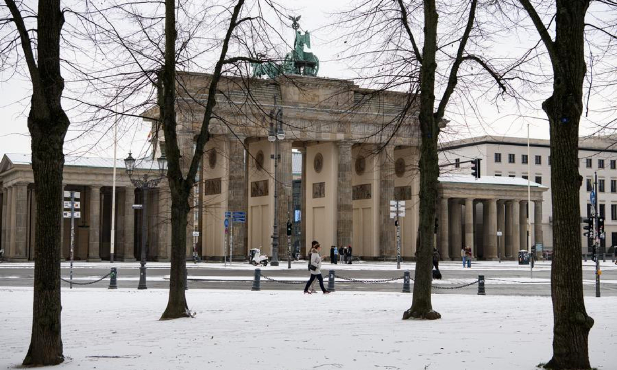 People walk past the Brandenburg Gate in Berlin, Germany, Nov. 24, 2025. Berlin saw its first snowfall of the winter season on Monday. (Xinhua/Zhang Haofu)