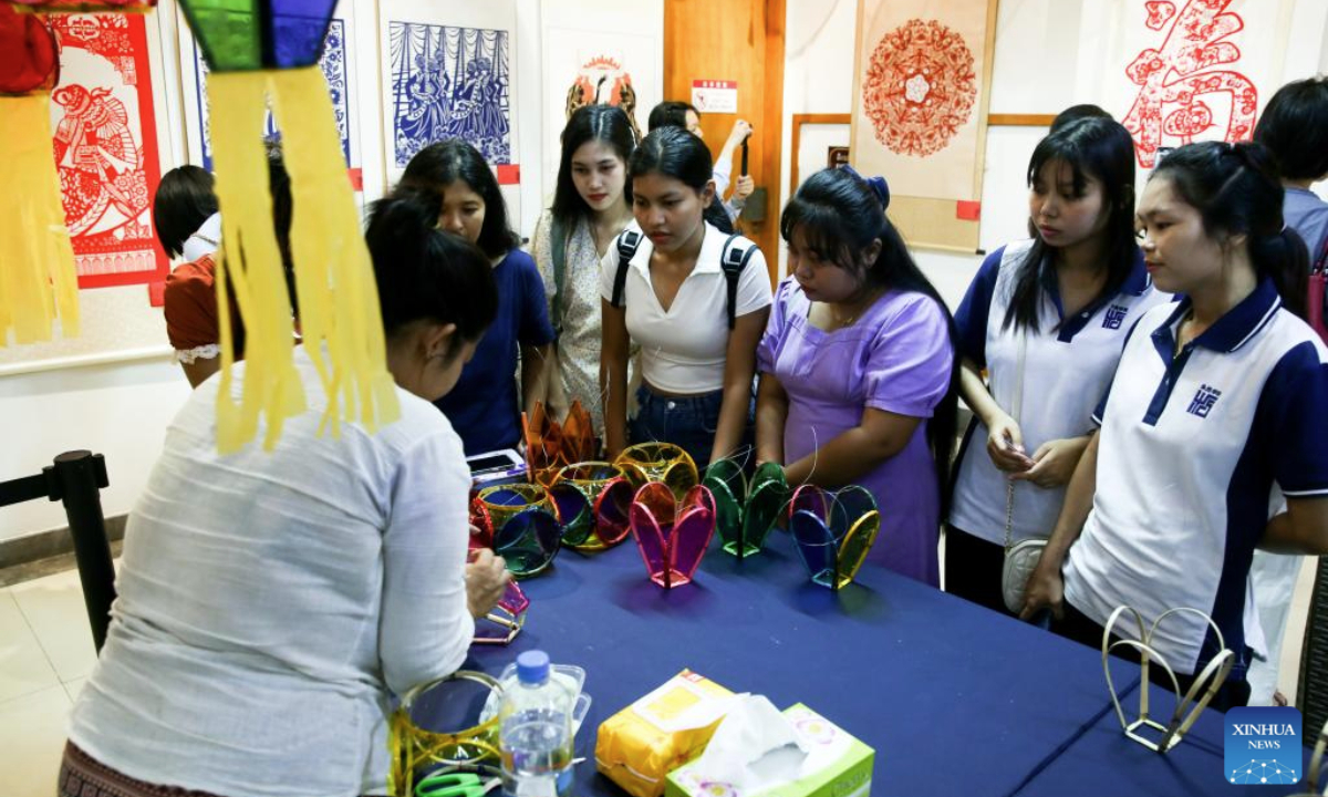 People attend a traditional Chinese paper-cutting exhibition at the China Cultural Center in Yangon, Myanmar, Nov. 5, 2025. A traditional Chinese paper-cutting exhibition was held at the China Cultural Center in Yangon on Wednesday. (Xinhua/Myo Kyaw Soe)