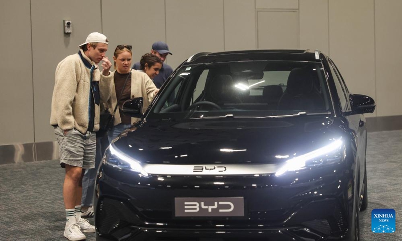 People view a Chinese BYD vehicle at the Take Charge Expo in Christchurch, New Zealand, Nov. 1, 2025. The on-going expo showcases the latest in battery electric vehicles with Chinese brands drawing attention from international buyers (Photo: Xinhua)