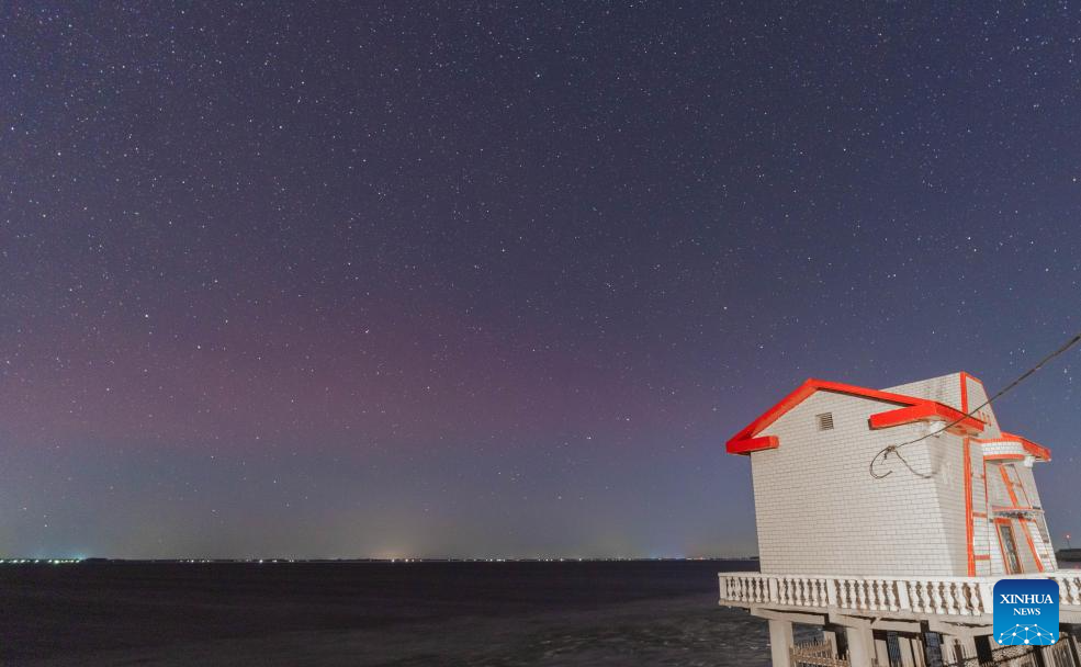 This photo taken on Nov. 13, 2025 shows the aurora seen on the bank of the Hulan River in Harbin, northeast China's Heilongjiang Province. (Photo by Li Xin/Xinhua)