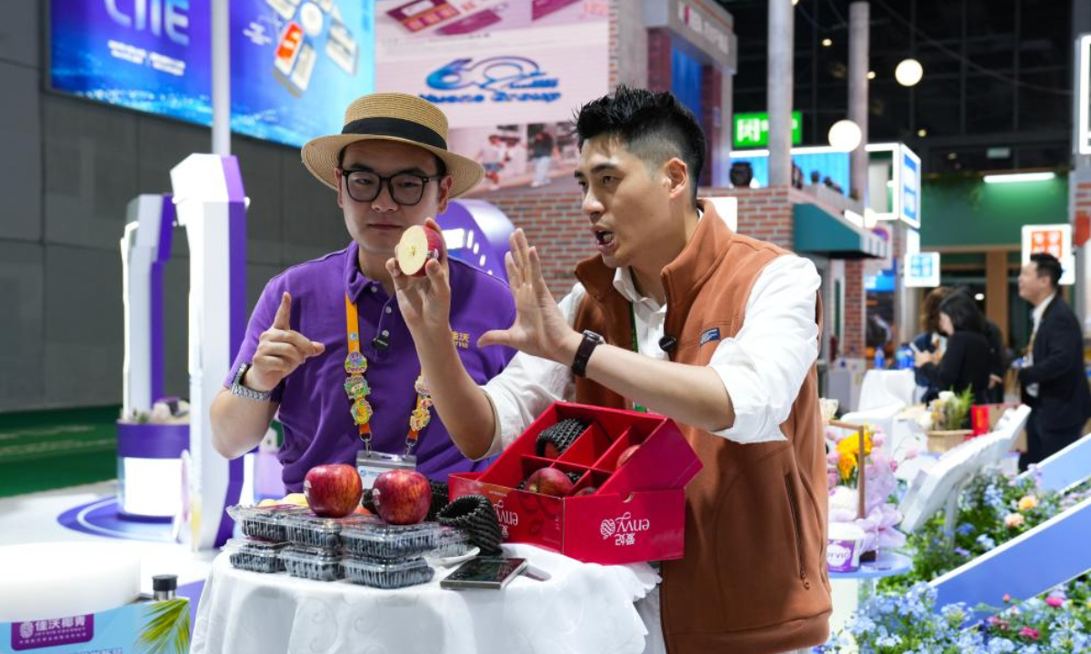 Exhibitors promote products via live-streaming at the Food and Agricultural Products exhibition area of the eighth China International Import Expo (CIIE) in east China's Shanghai, Nov. 5, 2025. (Xinhua/Du Xinyi)
