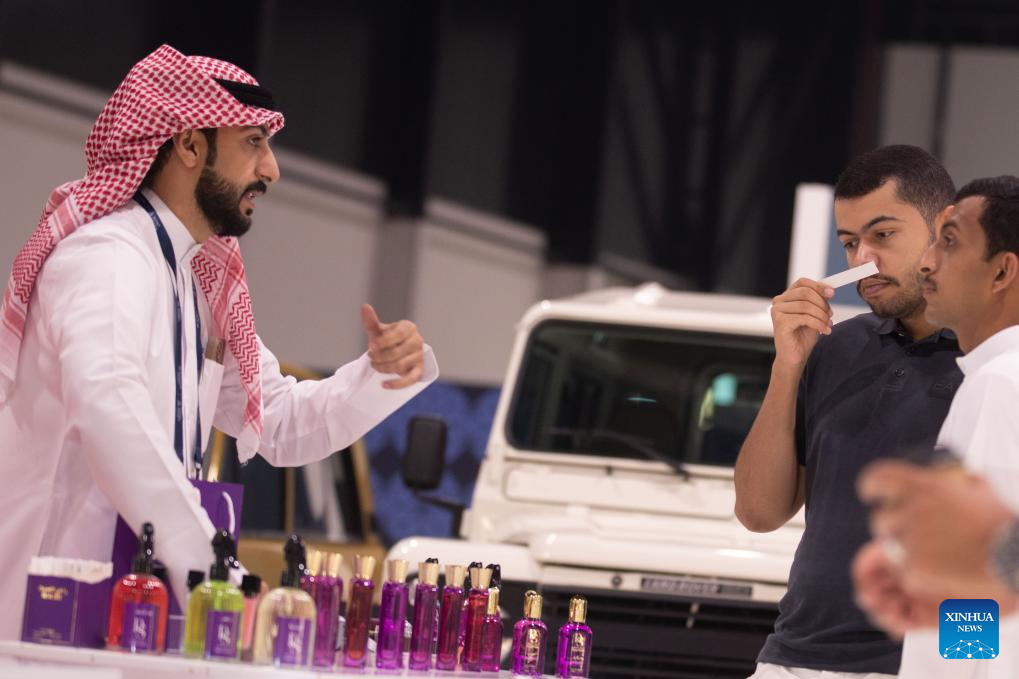 An exhibitor showcases perfumes at the Scent Arabia exhibition in Manama, Bahrain, Nov. 25, 2025. The Scent Arabia exhibition opened at Exhibition World Bahrain in Manama, Bahrain on Tuesday, featuring over 100 brands from the Gulf countries and worldwide, including perfumes, home fragrances and Arabian incense. The event is scheduled to run through Nov. 29. (Xinhua/Chen Junqing)