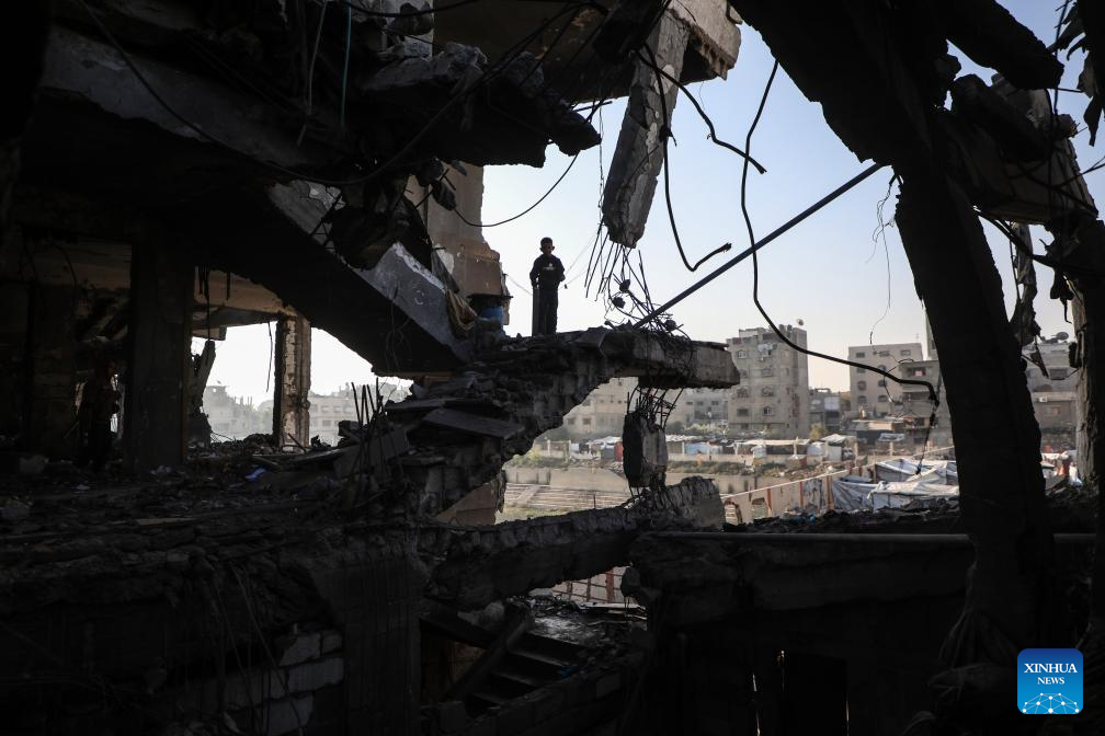 A Palestinian inspects the destroyed houses after Israeli airstrikes in Al-Zeitoun neighborhood east of Gaza City, Nov. 20, 2025. (Photo by Rizek Abdeljawad/Xinhua)
