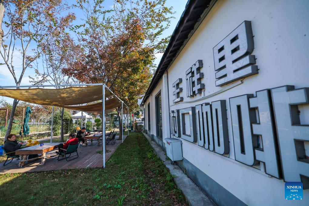 Tourists have a rest at a village cafe at a scenic spot in Lianfeng Village of Nanhu District, Jiaxing City, east China's Zhejiang Province, Nov. 18, 2025. In Zhejiang, the birthplace of the landmark Green Rural Revival Program, rural transformation over the past 22 years has evolved from merely improving living conditions to delivering common prosperity while building beautiful villages. Jiaxing City in Zhejiang has been consistently implementing the program to promote rural revitalization. (Xinhua/Xu Yu)