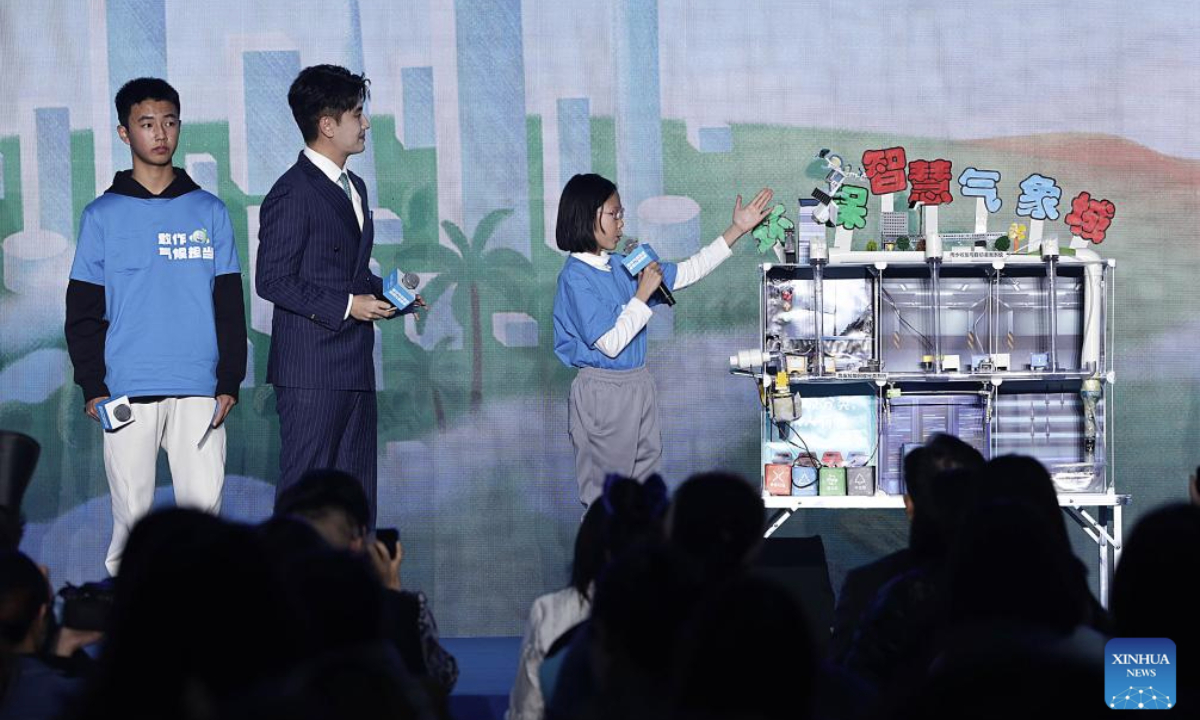 Guests and children attend an event themed Step up for Climate, Light up Children's Future, held to mark World Children's Day, in Beijing, capital of China, Nov. 20, 2025. (Xinhua/Zhang Yuwei)