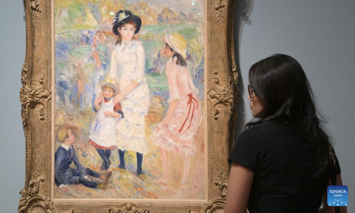 A journalist attends the media preview of Into the Modern: Impressionism from the Museum of Fine Arts, Boston art exhibition held at the National Gallery Singapore in Singapore, on Nov 12, 2025. The exhibition will open on Nov. 14, featuring artworks by artists like Claude Monet, Pierre-Auguste Renoir and Edgar Degas. (Photo by Then Chih Wey/Xinhua)