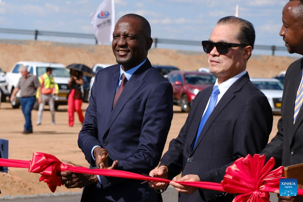 Veikko Nekundi (L), Namibia's Minister of Works and Transport, and Zhao Weiping, Chinese Ambassador to Namibia, attend a ribbon-cutting ceremony for the opening of the Chinese-aided Dr. Hage G. Geingob Freeway in Windhoek, Namibia, Nov. 10, 2025. Namibia officially inaugurated the Dr. Hage G. Geingob Freeway on Monday in the capital, Windhoek, marking the completion of a landmark infrastructure project set to transform regional transport and boost economic development. (Xinhua/Lin Jing)