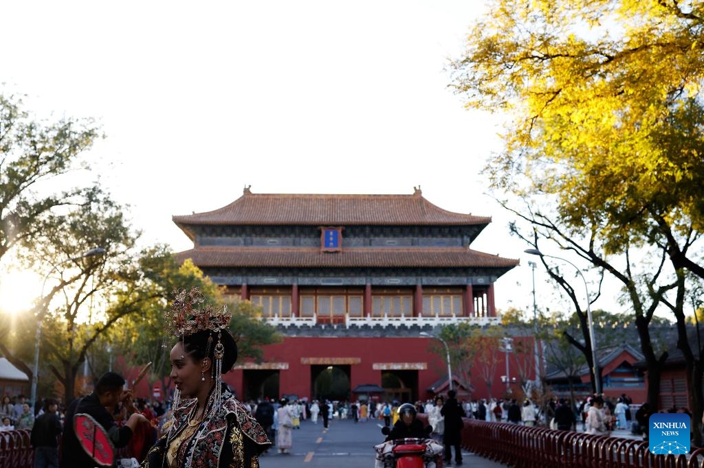 Ethiopian tourist Betty wearing traditional Chinese costumes enjoys her photoshoot experience outside Donghua Gate, as known as East Prosperity Gate of the Palace Museum in Beijing, capital of China, Nov. 1, 2025. From January to September 2025, Beijing has received approximately 3.88 million inbound tourists, a year-on-year increase of 42.9 percent, according to Beijing Municipal Bureau of Culture and Tourism. (Photo: Xinhua)