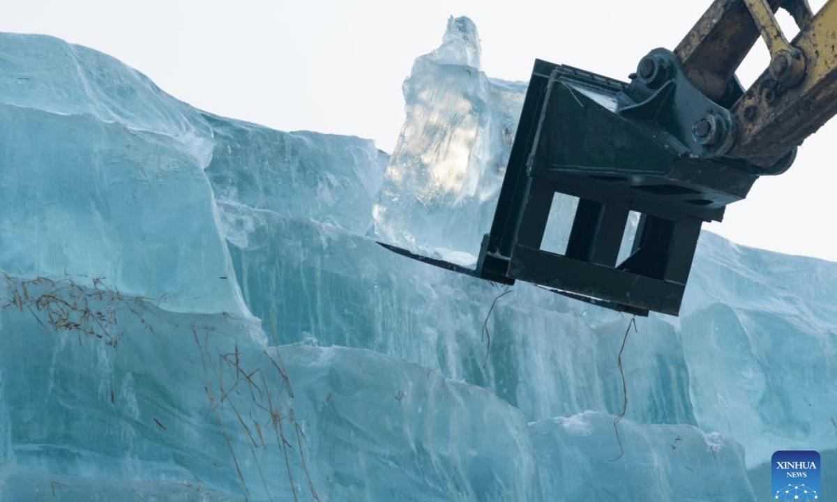 A machinery transports ice cubes at an ice storage site for the Harbin Ice-Snow World in Harbin, northeast China's Heilongjiang Province, Nov. 24, 2025. The 27th edition of the Harbin Ice-Snow World, a renowned seasonal theme park in Harbin, will officially begin construction on Nov. 25 this year. (Xinhua/Xie Jianfei)