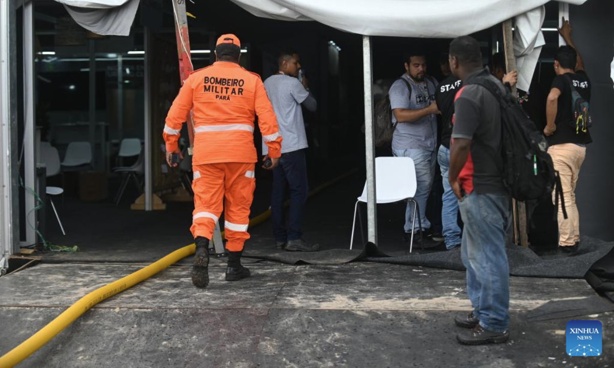 Firefighters and staff members inspect the venue of the 30th United Nations Climate Change Conference (COP30) after a fire broke out in Belem, Para state, Brazil, Nov. 20, 2025. A fire broke out on Thursday in a pavilion at the ongoing 30th UN Climate Change Conference in the Brazilian city of Belem, prompting evacuations by the fire department, according to local authorities. (Photo by Lucio Tavora/Xinhua)