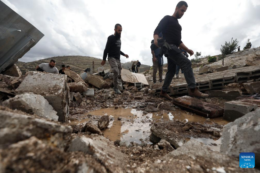 Palestinians inspect the damage at the site where a Palestinian man was killed in the Marka area south of Jenin in the West Bank, Nov. 25, 2025. (Photo by Nidal Eshtayeh/Xinhua)