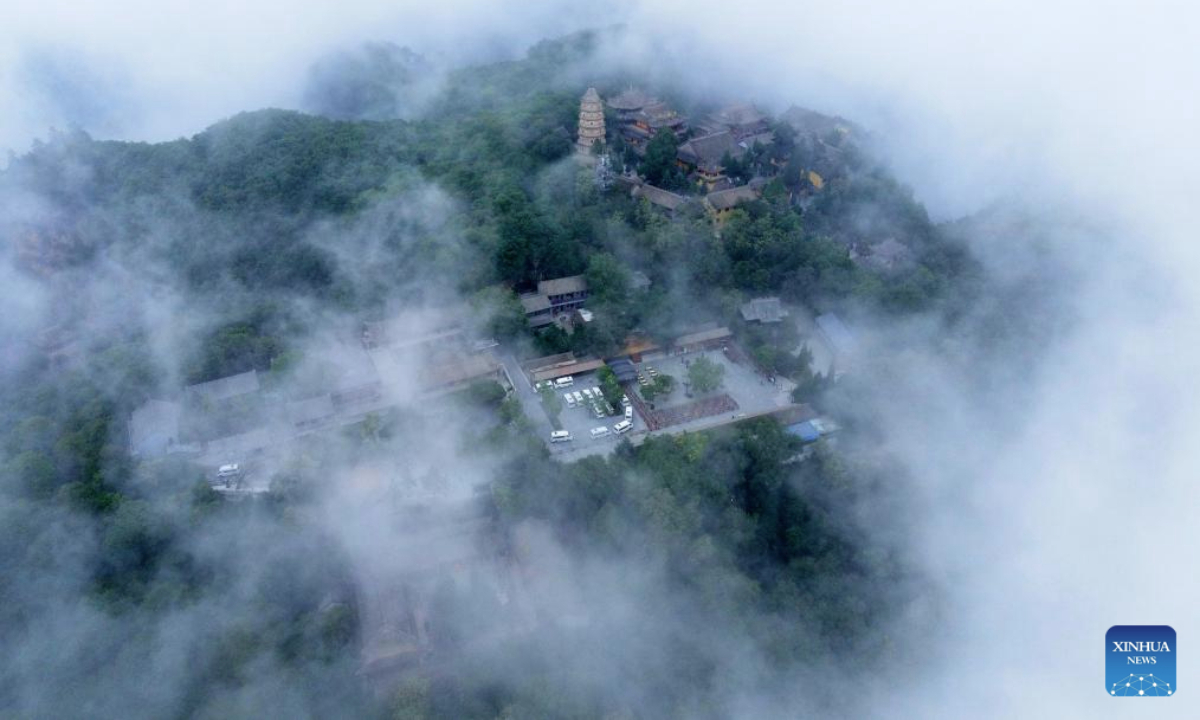 An aerial drone photo taken on July 11, 2025 shows a view of Kongtong Mountain in Pingliang City, northwest China's Gansu Province.

Pingliang in Gansu Province is a key node in the Loess Plateau-Sichuan-Yunnan Ecological barrier and a major ecological zone for soil and water conservation in the hilly areas. The city has transformed traditional industries like the coal-chemical sector and developed eco-friendly projects such as solar and wind power. The forest and grassland coverage of Pingliang has reached 46.07 percent, and it has been recognized as one of the first Chinese national ecological civilization demonstration zones. (Photo by Wu Xihui/Xinhua)