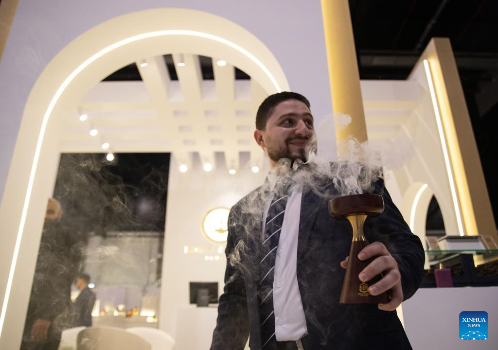 An exhibitor showcases Arabian incense at the Scent Arabia exhibition in Manama, Bahrain, Nov. 25, 2025. The Scent Arabia exhibition opened at Exhibition World Bahrain in Manama, Bahrain on Tuesday, featuring over 100 brands from the Gulf countries and worldwide, including perfumes, home fragrances and Arabian incense. The event is scheduled to run through Nov. 29. (Xinhua/Chen Junqing)