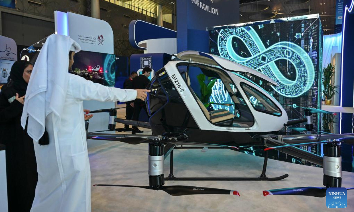 People visit the Qatar booth at the MWC25 Doha in Doha, Qatar, on Nov. 25, 2025. MWC25 Doha, the first-ever MWC Series event held in the Middle East and North Africa, takes place from Nov. 25 to Nov. 26 in Doha. (Photo by Nikku/Xinhua)