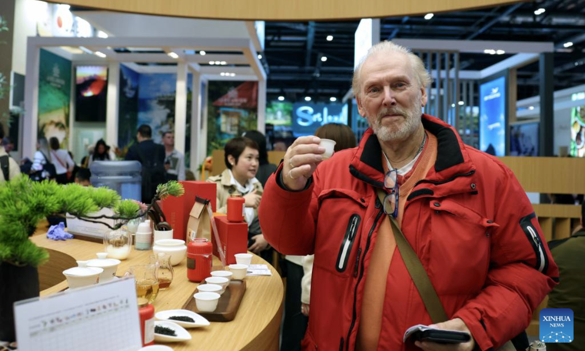 A man tastes Chinese tea at the China pavilion of the World Travel Market (WTM) London 2025 in London, Britain, Nov. 4, 2025. The WTM London 2025 opened on Tuesday, with the China pavilion drawing attention for its abundant tourism resources and cultural appeal. (Xinhua/Li Ying)