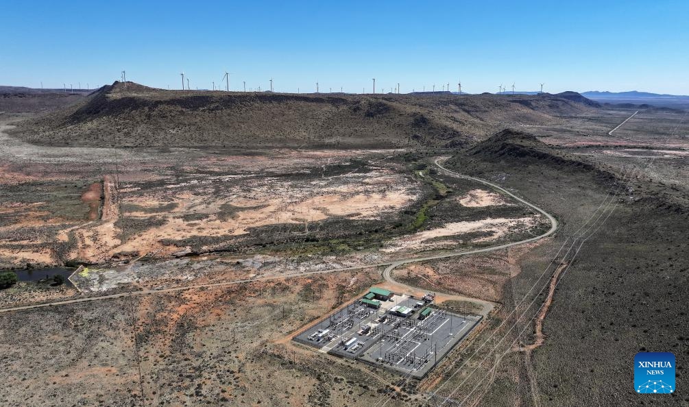An aerial photo taken on Oct. 22, 2025 shows a substation and wind turbines of De Aar Wind Power Project in De Aar, Northern Cape, South Africa. To bolster Africa's green development, China has assisted countries in constructing several clean energy projects. The De Aar Wind Farm has changed South Africa's energy landscape. As the first wind power project financed, constructed and operated by a Chinese company in Africa, it supplies 760 million kilowatt-hours of clean electricity annually, meeting the electricity needs of 300,000 households. (Photo: Xinhua)