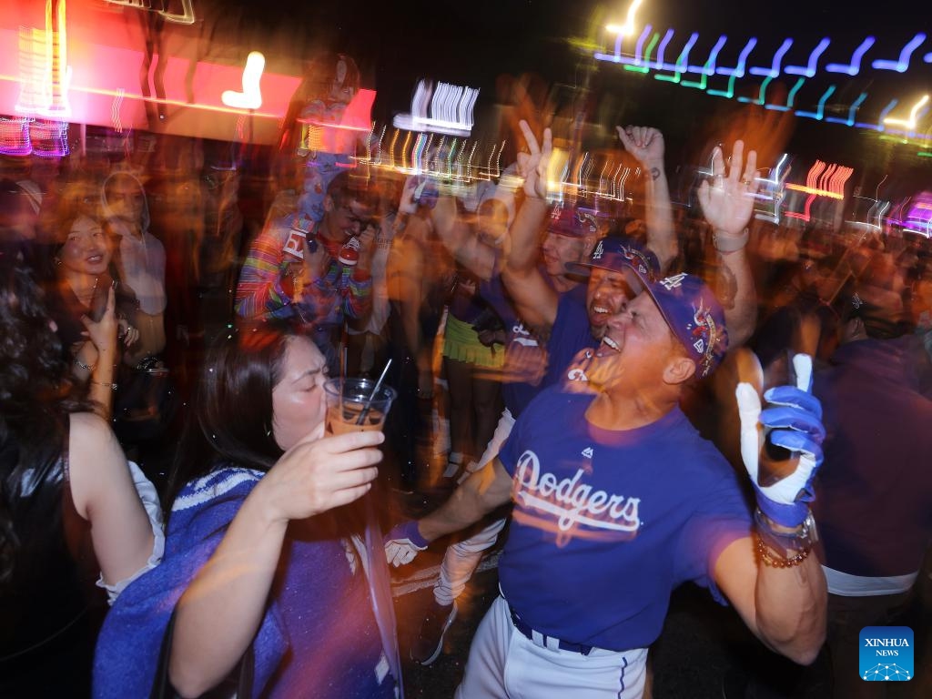 Participants dressed as Dodgers fans attend the Halloween Carnival in West Hollywood, Los Angeles, California, the United States, on Oct. 31, 2025. (Photo: Xinhua)