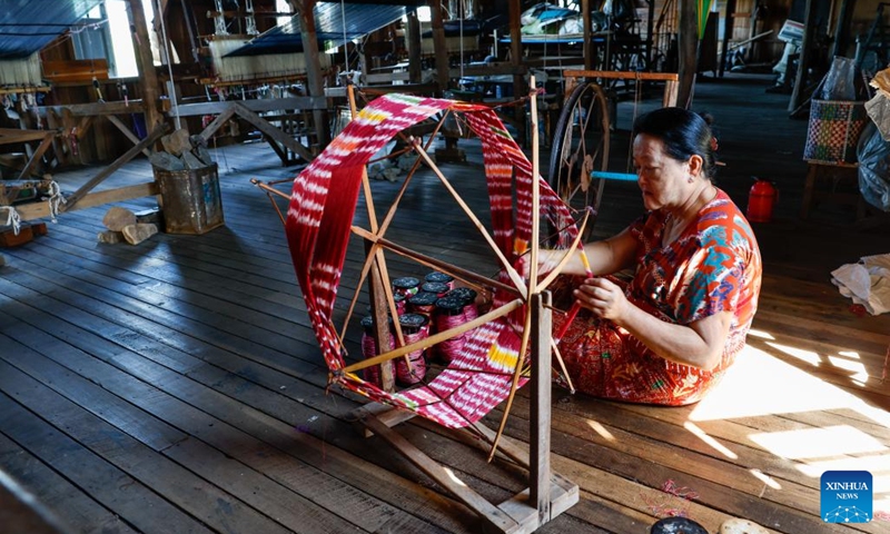 A woman works at a hand-weaving workshop on Inle Lake in Nyaungshwe township, Shan state, Myanmar, Oct. 31, 2025. (Photo: Xinhua)