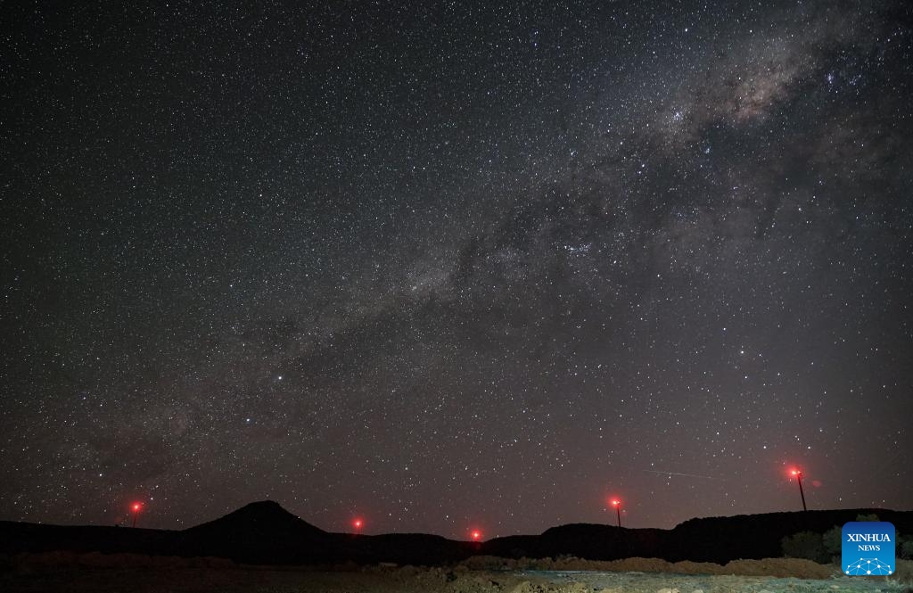 Beacon lights on wind turbines of the De Aar Wind Power Project are seen under the starry sky in De Aar, Northern Cape, South Africa, Oct. 22, 2025. To bolster Africa's green development, China has assisted countries in constructing several clean energy projects. The De Aar Wind Farm has changed South Africa's energy landscape. As the first wind power project financed, constructed and operated by a Chinese company in Africa, it supplies 760 million kilowatt-hours of clean electricity annually, meeting the electricity needs of 300,000 households. (Photo: Xinhua)