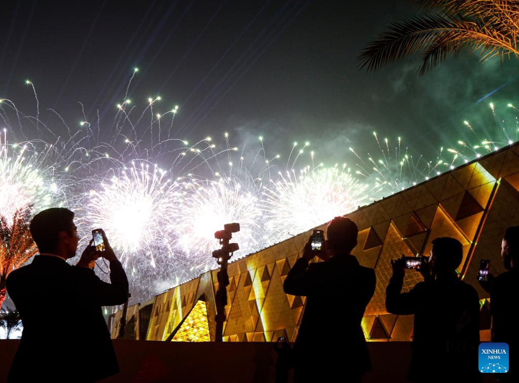 People capture images of a firework and light show during the inauguration of the Grand Egyptian Museum (GEM) in Giza, Egypt, Nov. 1, 2025. After two decades of construction, Egypt on Saturday inaugurated the GEM -- the world's largest museum dedicated to a single civilization -- during a grand ceremony held near the pyramids and the Sphinx, marking a landmark cultural event for the country renowned for its rich heritage. (Photo: Xinhua)