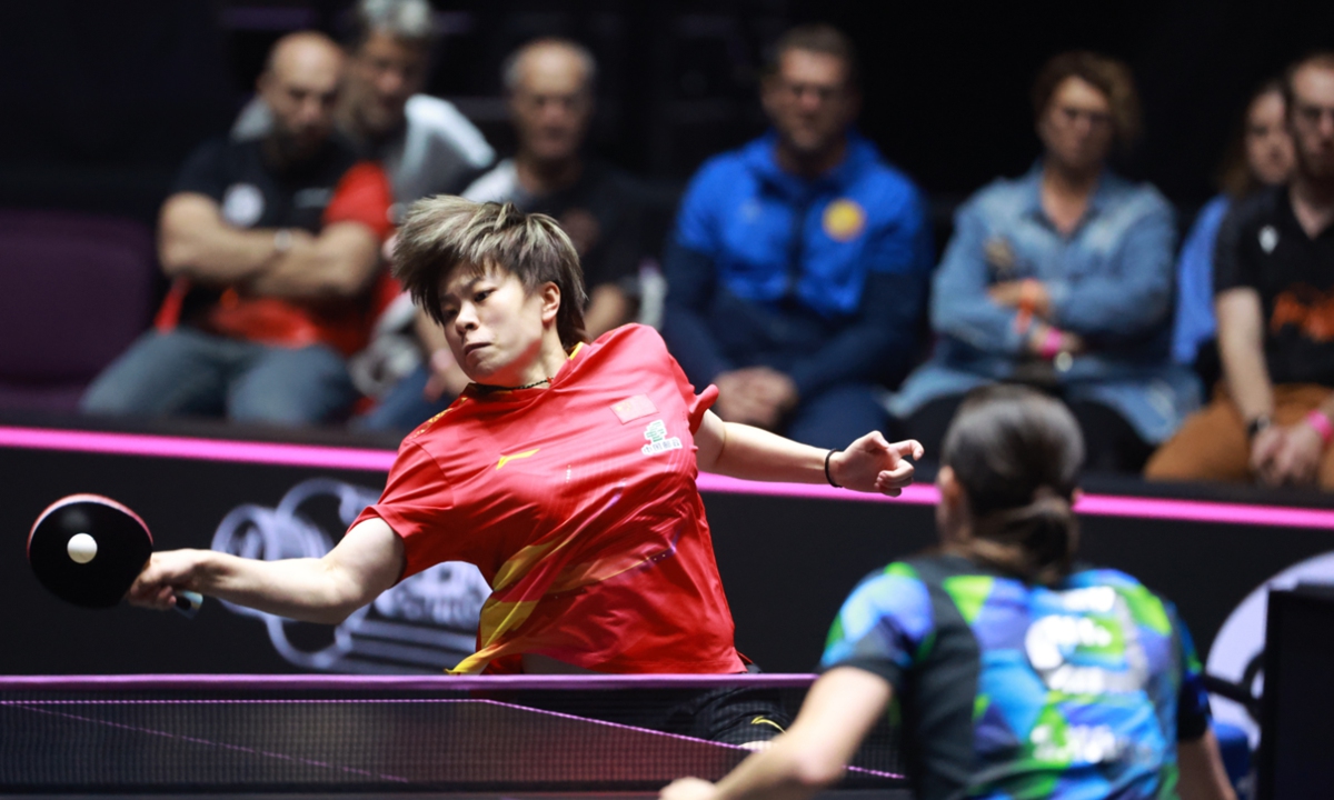 Chinese table tennis player Wang Yidi hits a return to German veteran Sabine Winter during the women's singles final at the World Table Tennis (WTT) Champions Montpellier on November 2, 2025 in Montpellier, France. The Chinese third seed lost the opening two games but managed to win 4-3. Photo: VCG