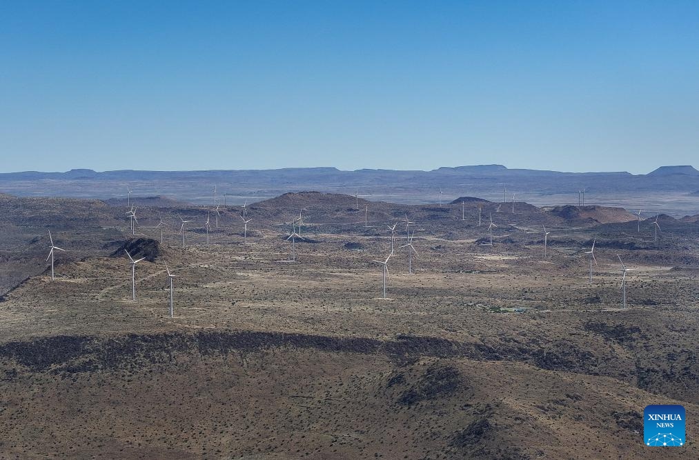 An aerial photo taken on Oct. 22, 2025 shows wind turbines of De Aar Wind Power Project in De Aar, Northern Cape, South Africa. To bolster Africa's green development, China has assisted countries in constructing several clean energy projects. The De Aar Wind Farm has changed South Africa's energy landscape. As the first wind power project financed, constructed and operated by a Chinese company in Africa, it supplies 760 million kilowatt-hours of clean electricity annually, meeting the electricity needs of 300,000 households. (Photo: Xinhua)