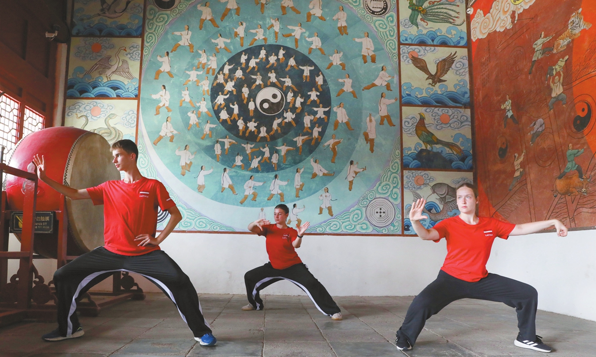 Latvian students practice Taijiquan at an Ancestral Temple for Taijiquan in Wen County, Central China's Henan Province, on August 16, 2025. Photos on this page: VCG