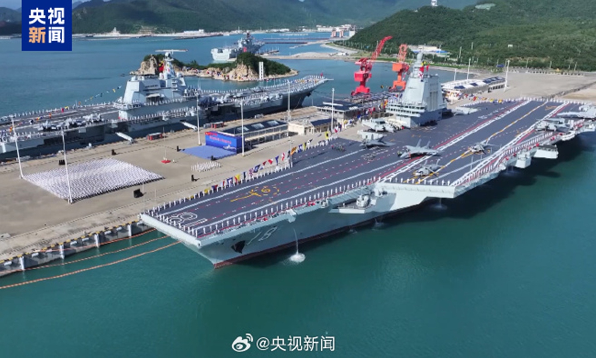 China's third aircraft carrier, the electromagnetic catapults-equipped Fujian (front), is officially commissioned at a naval port in Sanya, South China's Hainan Province on November 5, 2025. Photo: Screenshot from China Central Television