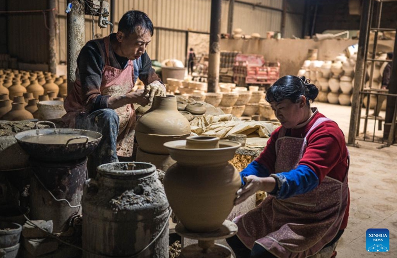 Villagers make pottery products at a workshop in Liaohu Village of Qujing, southwest China's Yunnan Province, Nov. 5, 2025. Located on the bank of the Nanpan River in the city of Qujing, the Liaohu Village boasts a thousand-year pottery-making tradition. Photo: Xinhua