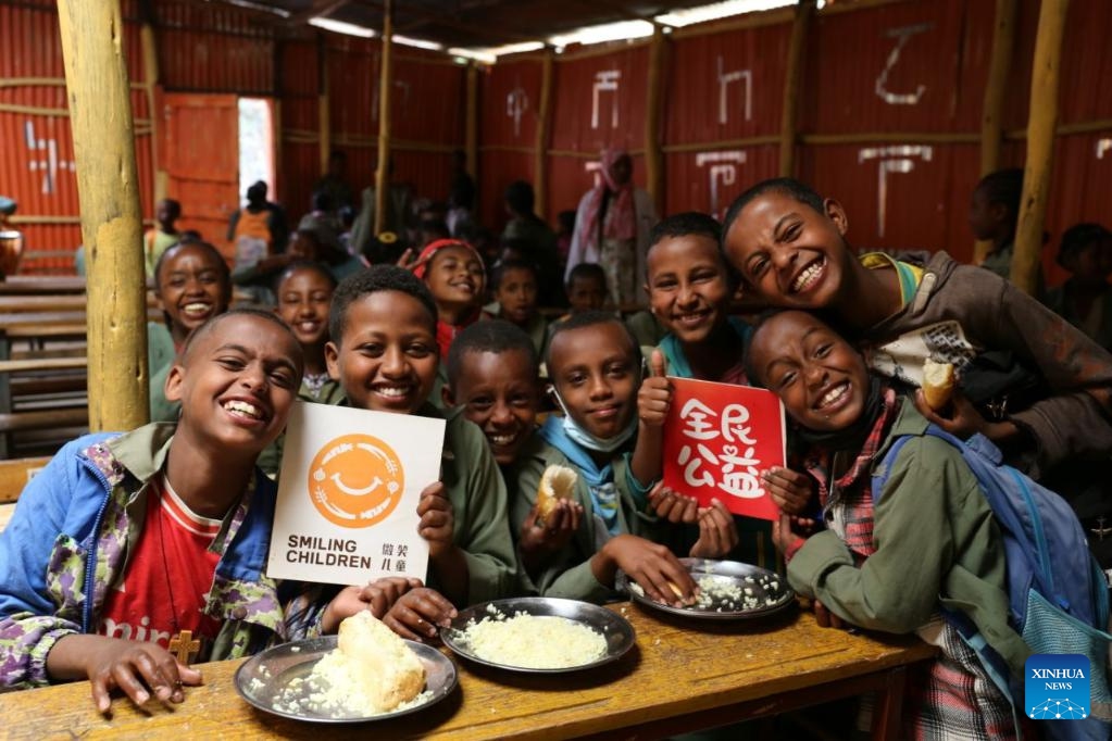 Students benefiting from the Smiling Children Program pose for a group photo at a primary school near Addis Ababa, capital of Ethiopia, on Sept. 30, 2025. (China Foundation for Rural Development/Handout via Xinhua)