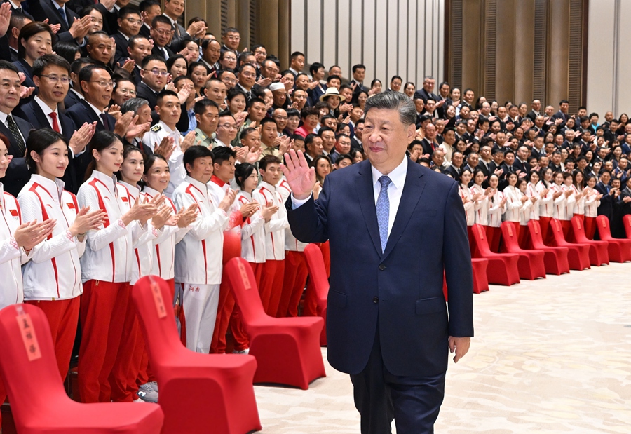 Chinese President Xi Jinping, also general secretary of the Communist Party of China Central Committee and chairman of the Central Military Commission, meets with representatives of national model units and individuals in mass sports and competitive sports in Guangzhou, capital of south China's Guangdong Province, Nov. 9, 2025. (Xinhua/Xie Huanchi)
