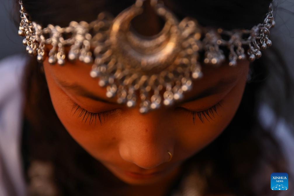 A girl in traditional attire takes part in the Sama Chakeva Festival in Kathmandu, Nepal, on Nov. 8, 2025. Sama Chakeva, a festival of wishing longevity, health and prosperity between brothers and sisters, was celebrated here on Saturday. (Photo by Sulav Shrestha/Xinhua)