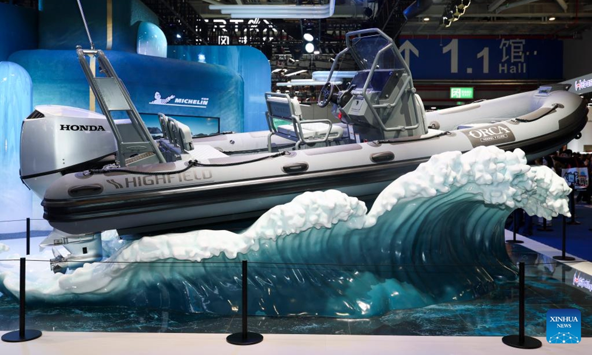 A composite-coated rigid inflatable boat is seen at the booth of Michelin at the Automobile and Smart Mobility exhibition area of the eighth China International Import Expo (CIIE) in east China's Shanghai, Nov. 8, 2025. The eighth CIIE showcased a range of new mobility products and innovative technologies, unfolding a diversified and multi-dimensional vision of future transportation. (Xinhua/Wang Xiang)