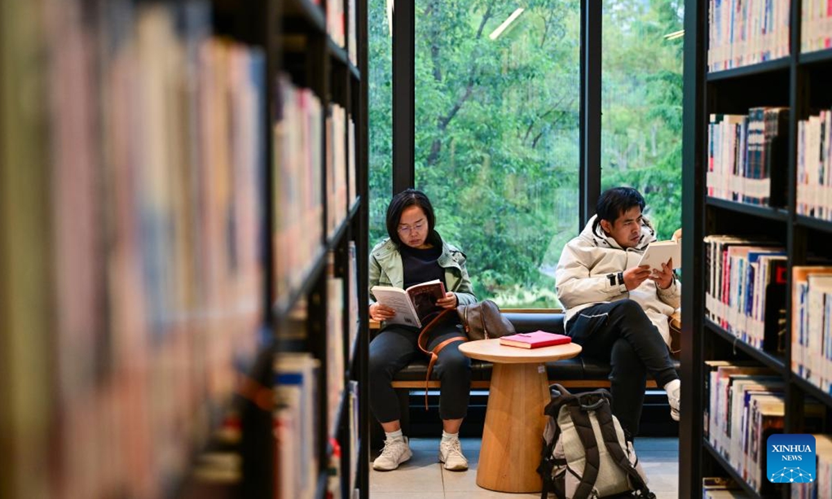 People read books at a public library in east China's Shanghai, Nov. 9, 2025. In recent years, Shanghai has focused on optimizing historical and cultural districts, developing urban cultural lifestyle areas, enriching citizens' cultural lives, and promoting the deep integration of culture and tourism. (Xinhua/Cai Xiangxin)