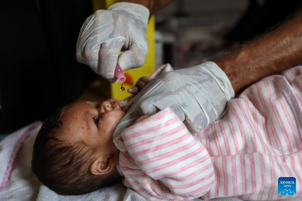 A Palestinian child receives vaccination at a field hospital in central Gaza City, on Nov. 9, 2025. (Photo by Rizek Abdeljawad/Xinhua)