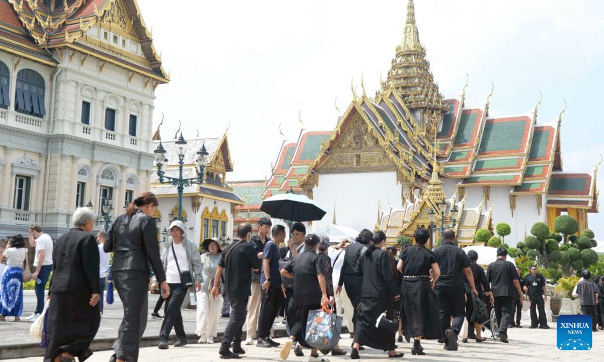 People enter the Grand Palace to mourn for Thailand's Queen Mother Sirikit, who passed away on Oct. 24 at the age of 93, in Bangkok, Thailand, on Nov. 9, 2025. (Xinhua/Rachen Sageamsak)
