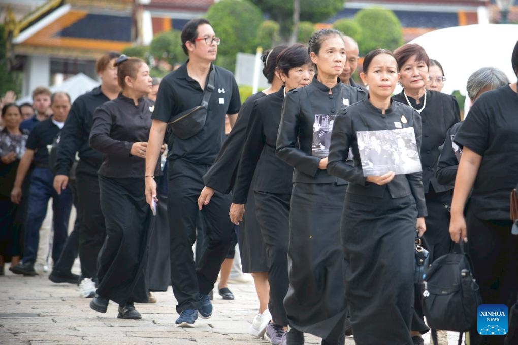 People enter the Grand Palace to mourn for Thailand's Queen Mother Sirikit, who passed away on Oct. 24 at the age of 93, in Bangkok, Thailand, on Nov. 9, 2025. (Xinhua/Rachen Sageamsak)
