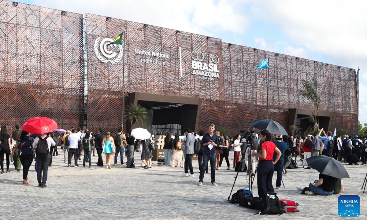 Participants arrive at the venue of the 30th United Nations climate change conferencein Belem, Brazil, Nov. 10, 2025. The 30th United Nations climate change conference, commonly known as COP30, opened Monday in Belem, in the Brazilian state of Para, with the aim of putting the fight against climate change back in the center of international priorities, according to local authorities. (Photo by Claudia Martini/Xinhua)