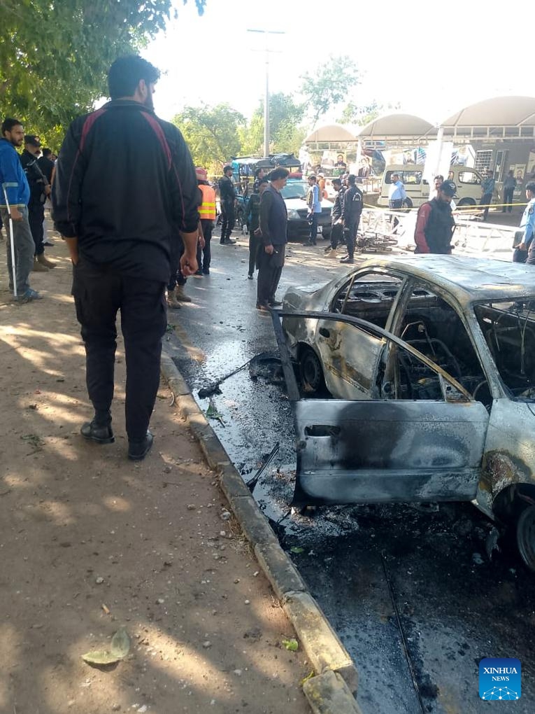This photo taken with a mobile phone on Nov. 11, 2025 shows the blast site in Islamabad, Pakistan. At least 12 people were killed and 27 others injured on Tuesday afternoon in a suicide blast outside the district courts in Pakistan's capital Islamabad, Interior Minister Mohsin Naqvi told local media. (Xinhua)