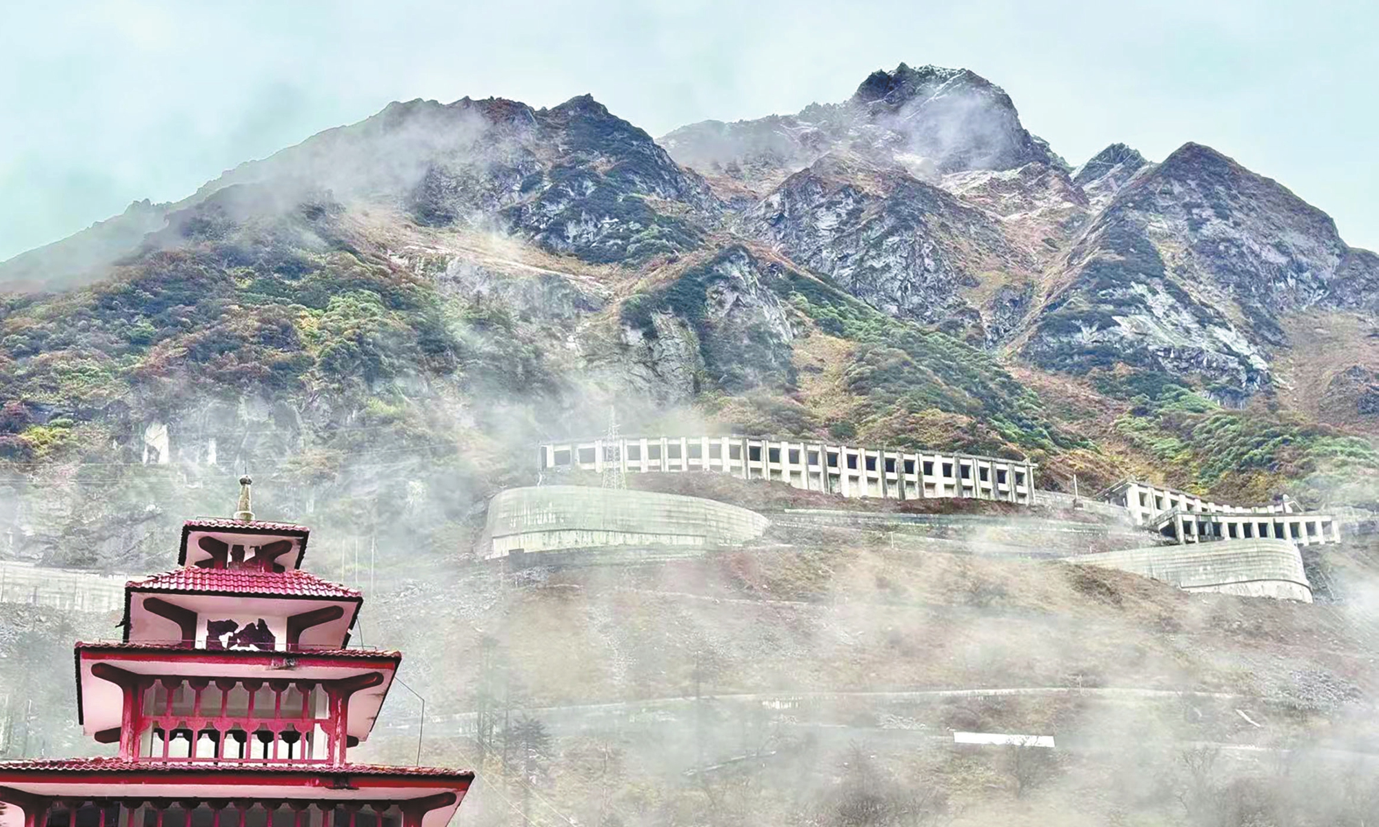 A winding road connecting Medog with the outside world climbs through the mountains. Photo: Shan Jie/GT