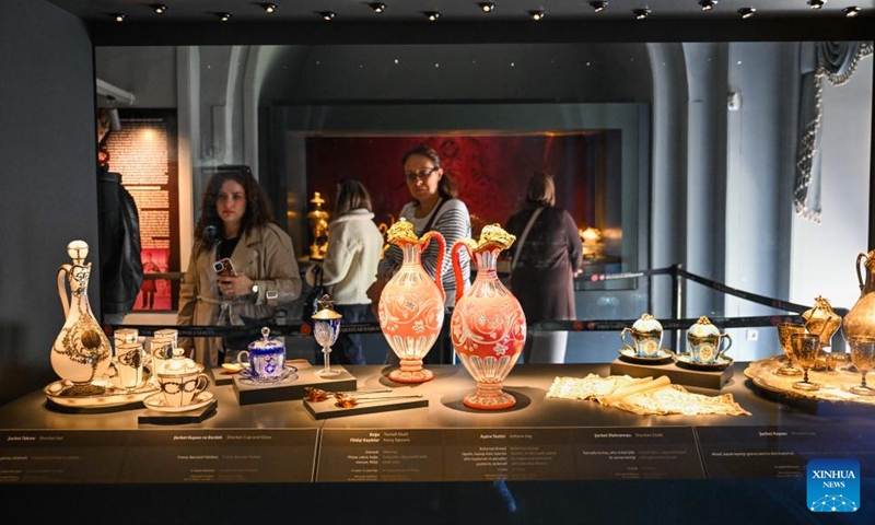 Visitors view exhibits at the Dolmabahce Palace in Istanbul, Türkiye, Nov. 15, 2025. The Dolmabahce Palace, located on the shores of the Bosphorus, was once used as a royal garden. The name Dolmabahce literally means filled garden, hinting at the historical fact that the palace and its grounds were constructed on a former bay of the Bosphorus that was deliberately filled in during the 17th century. Since 1984, the Dolmabahce Palace, along with its original furnishings, has been open to the public as a palace museum. (Xinhua/Liu Lei)