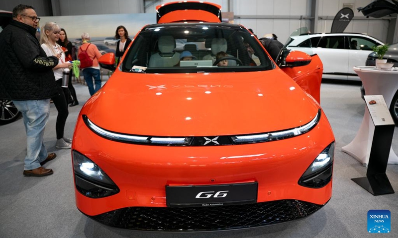 People visit the exhibition area of Xpeng at the 7th e-SALON in Prague, the Czech Republic, Nov. 14, 2025. The e-SALON, a trade fair for passenger and commercial vehicles with alternative propulsion, opened to public on Friday and will last until Sunday. Photo: Xinhua