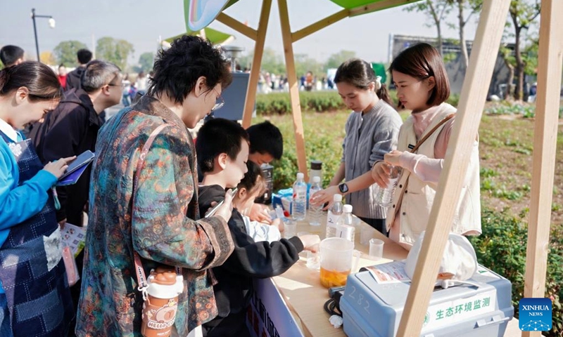 Children try water quality testing during an event of the World Children's Day in Hangzhou, east China's Zhejiang Province, on Nov. 15, 2025. The World Children's Day will fall on Nov. 20 this year. Various activities were held across the country to hail the arrival of the day. Photo: Xinhua