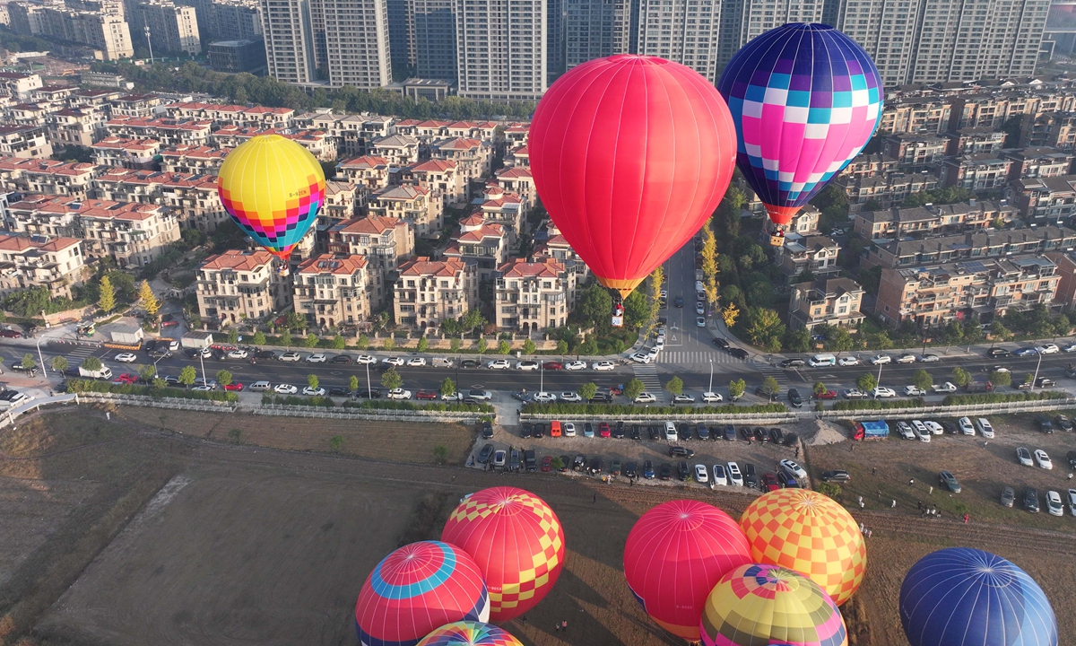 Ninety enthusiasts from across the country take to the sky in 30 hot air balloons in Wuyi, East China's Zhejiang Province on November 16, 2025. Zhejiang has proposed supporting the development of low-altitude agricultural, cultural and tourism activities such as sightseeing using hot air balloon tours, according to the Xinhua News Agency. Photo: cnsphoto