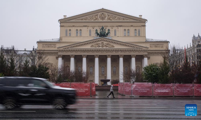 A vehicle passes by the Bolshoi Theatre in snow in Moscow, Russia, on Nov. 15, 2025. Moscow on Friday saw its first snowfall since the beginning of winter this year. Photo: Xinhua