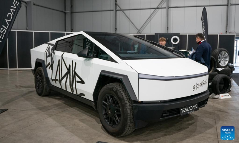 People visit the exhibition area of Tesla at the 7th e-SALON in Prague, the Czech Republic, Nov. 14, 2025. The e-SALON, a trade fair for passenger and commercial vehicles with alternative propulsion, opened to public on Friday and will last until Sunday. Photo: Xinhua