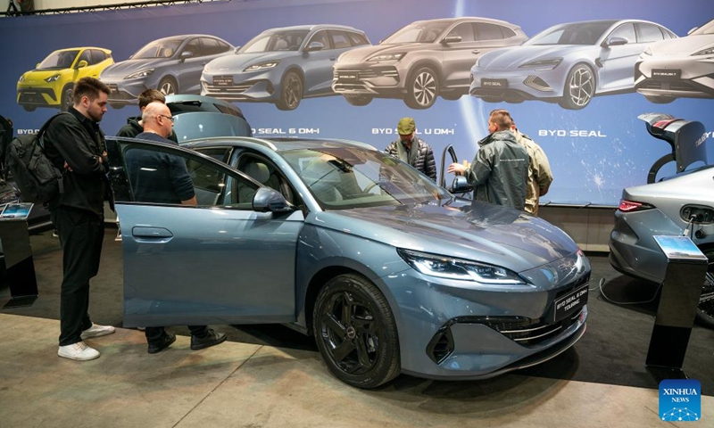 People visit the exhibition area of BYD at the 7th e-SALON in Prague, the Czech Republic, Nov. 14, 2025. The e-SALON, a trade fair for passenger and commercial vehicles with alternative propulsion, opened to public on Friday and will last until Sunday.  Photo: Xinhua