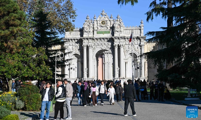 This photo taken on Nov. 15, 2025 shows the gate of the Dolmabahce Palace in Istanbul, Türkiye. The Dolmabahce Palace, located on the shores of the Bosphorus, was once used as a royal garden. The name Dolmabahce literally means filled garden, hinting at the historical fact that the palace and its grounds were constructed on a former bay of the Bosphorus that was deliberately filled in during the 17th century. Since 1984, the Dolmabahce Palace, along with its original furnishings, has been open to the public as a palace museum. (Xinhua/Liu Lei)