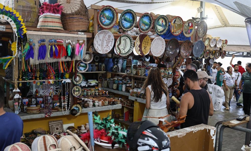 Visitors shop at stalls at the Ver-o-Peso Market in Belem, Brazil, Nov. 16, 2025. (Photo by Claudia Martini/Xinhua)