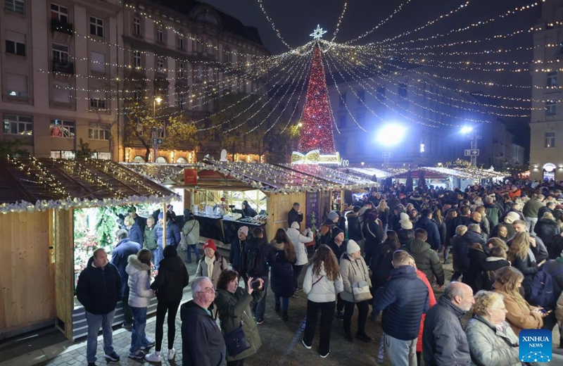 People visit a Christmas market in downtown Budapest, Hungary, on Nov. 15, 2025. The market opened here on Friday and will last till Jan. 1, 2026. (Photo by Attila Volgyi/Xinhua)